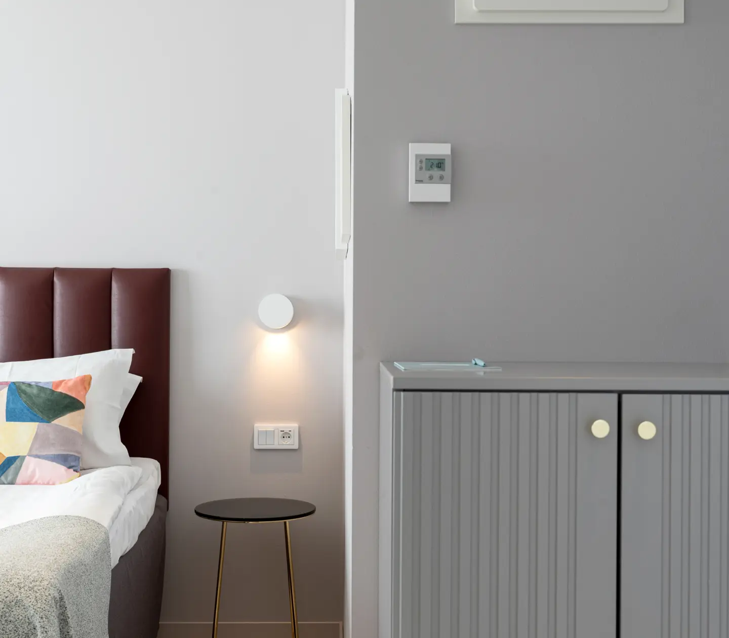Hotel room with double bed and sideboard