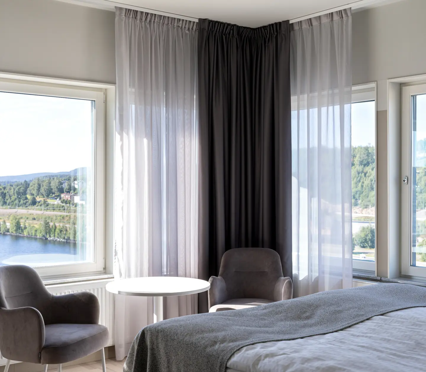 Hotel room with armchairs and window